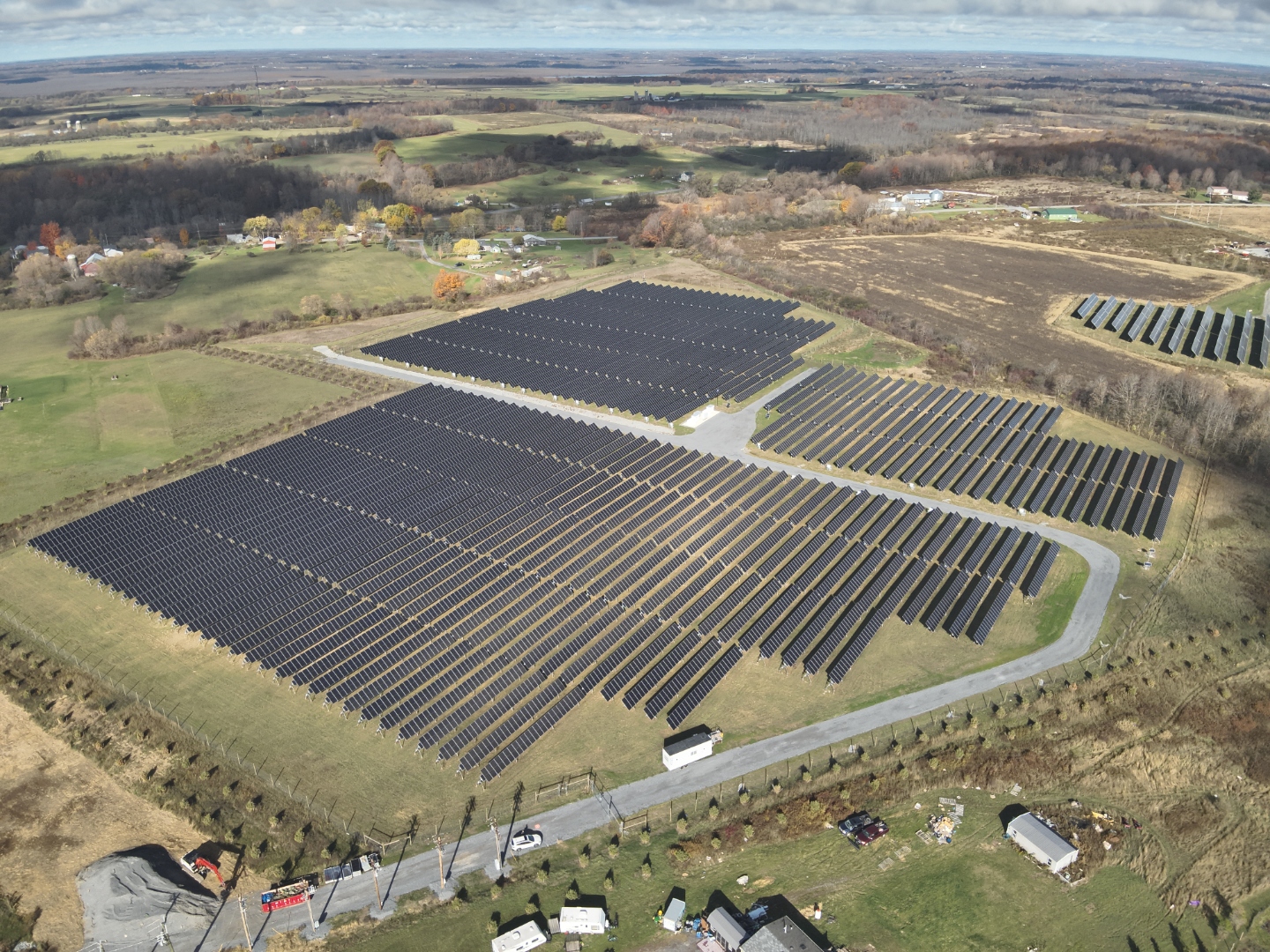 Aerial view of a solar array and surrounding landscape